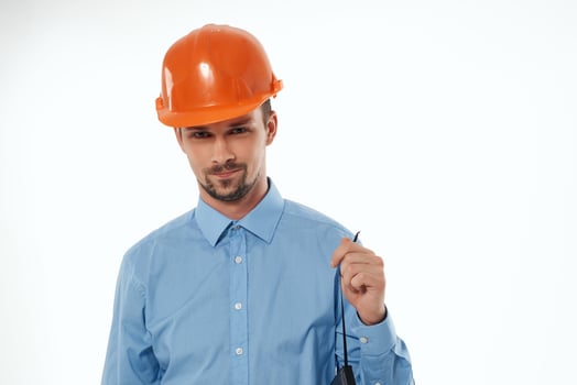 man in construction uniform blueprints builder isolated background photo