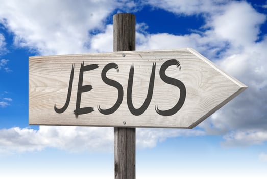 Jesus - Wooden Signpost with one Arrow and Cloudy Sky in Background photo