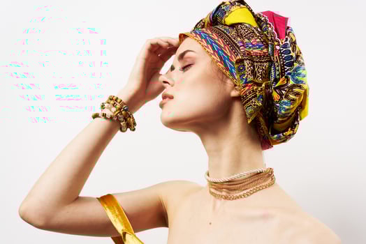 cheerful woman with multi-colored turban on her head decoration posing photo