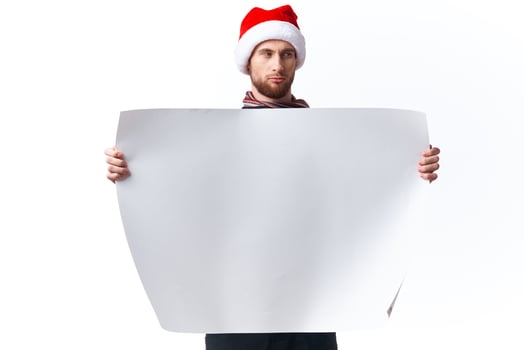 handsome man in New Year's clothes holding a banner holiday copy-space studio photo