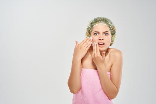 woman squeezes pimples on her face dermatology skin problems photo