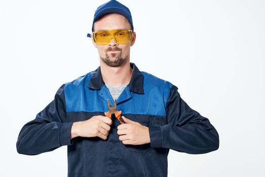 man in construction uniform pliers repair construction professionals photo