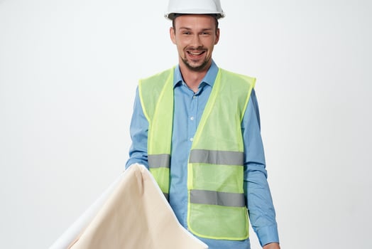 man in construction uniform blueprints builder isolated background photo