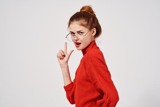 portrait of a woman in a red sweater Lifestyle light background photo