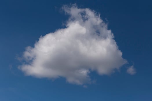 white fluffy cloud in a blue sky photo