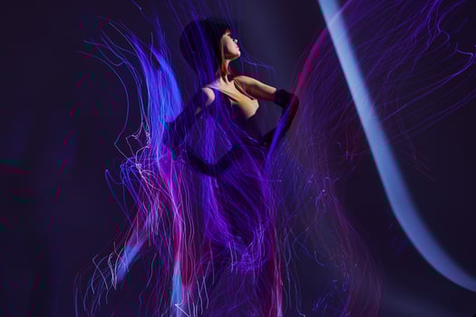 Positive young woman neon lines light posing studio model unaltered photo