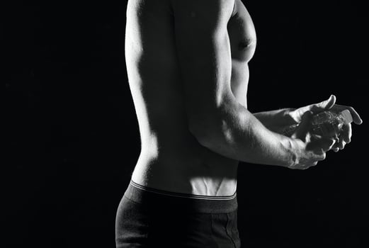 a man in black panties an inflated body black and white photo fitness