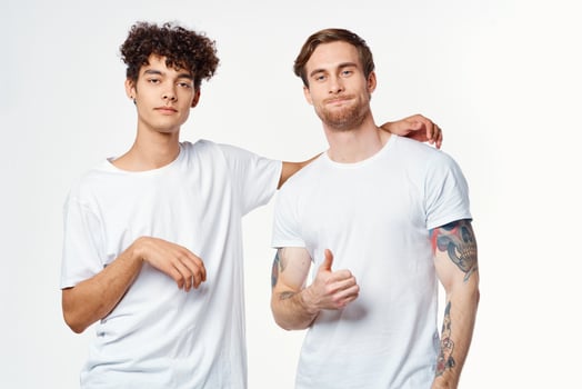 two guys in white t-shirts next to friendship communication emotions photo