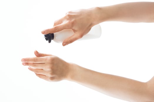 lotion in female hands moisturizing and skin care health photo