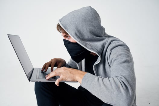 male thief hooded head hacking technology security isolated background photo