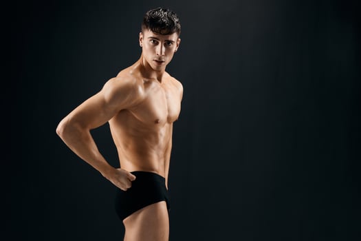 man with pumped up abs bodybuilder workout model photo