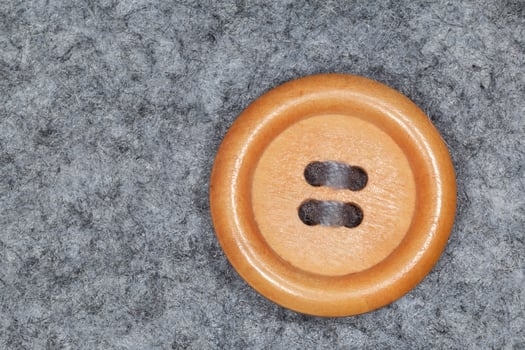 round button sewed on to gray felt photo