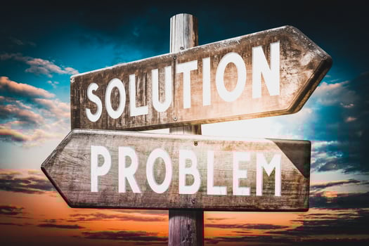 Problem, Solution - Wooden Signpost with Two Arrows, Sunset Sky in Background photo