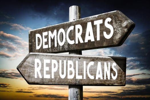Democrats, Republicans - Wooden Signpost with Two Arrows, Sunset Sky in Background photo