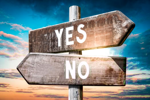 Yes, No - Wooden Signpost with Two Arrows, Sunset Sky in Background photo