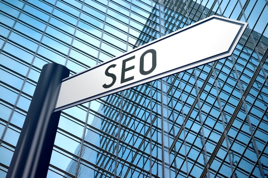 SEO - Signpost With One Arrow, Modern Office Building in Background photo