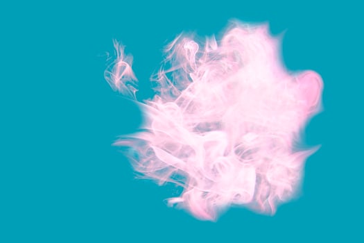 Pink gentle smoke on a blue background. photo
