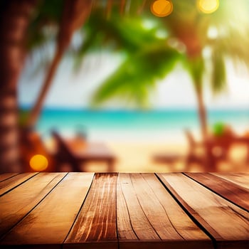 Old wooden table top on blurred beach background with coconut palm leaf. Concept Vacation, Summer, Beach, Sea - image photo