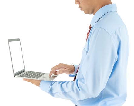 Businessman holding a laptop with clipping path photo