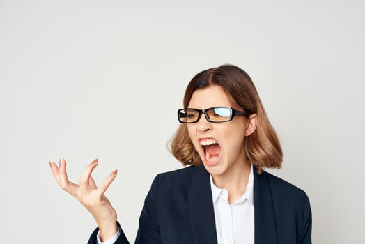 Business woman in suit gestures with hand emotions work Studio photo