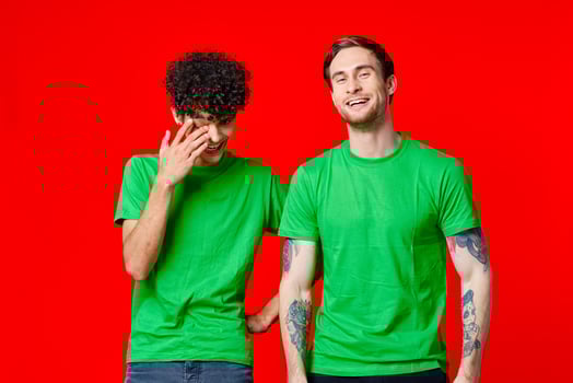 two friends green t-shirts emotions communication joy photo