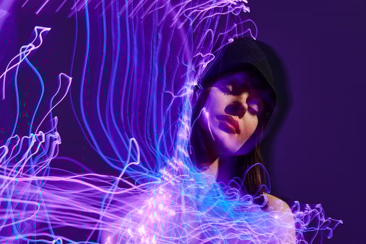 Beautiful fashionable girl neon lines light posing studio model unaltered photo