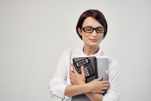 Businesswoman with glasses self-confidence light background photo