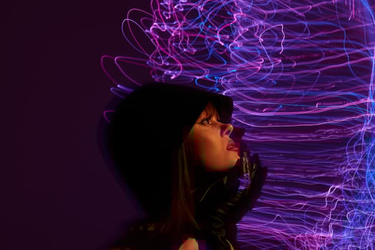 Pretty young female neon lines posing model glamor color background unaltered photo