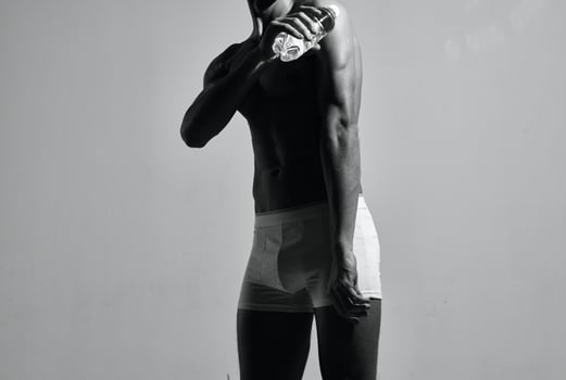 male bodybuilder in white shorts posing athlete workout photo