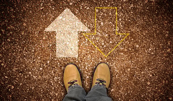Yellow Leather Shoes and Chalky Forward and Backward Arrows on Ground photo