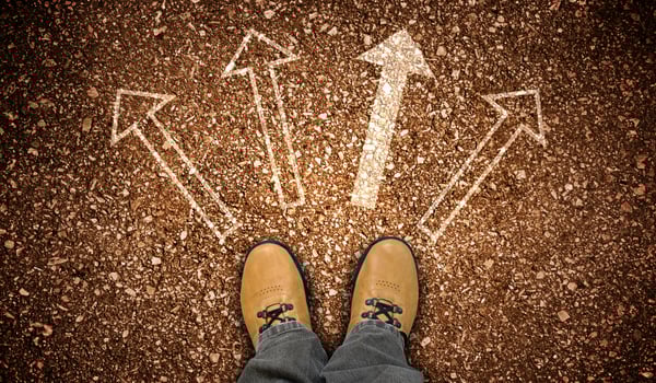 Yellow Leather Shoes and Four Chalky Arrows on Ground - Choice Concept photo
