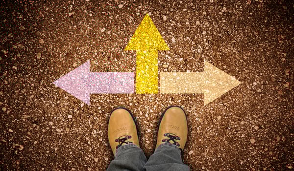 Yellow Leather Shoes and Three Colorful Chalky Arrows on Ground - Strategy Concept photo