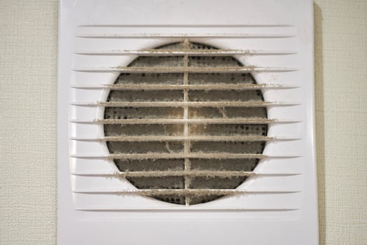 Dirty air ventilation grill of HVAC with clogged filter. photo