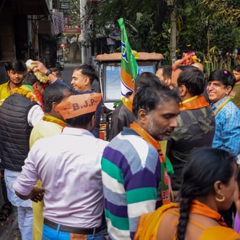 Delhi, India, December 02 2022 -Bharatiya Janata Party - BJP supporter during mega road show in support of BJP candidate Pankaj Luthara to file nomination papers ahead of MCD local body Elections 2022 photo