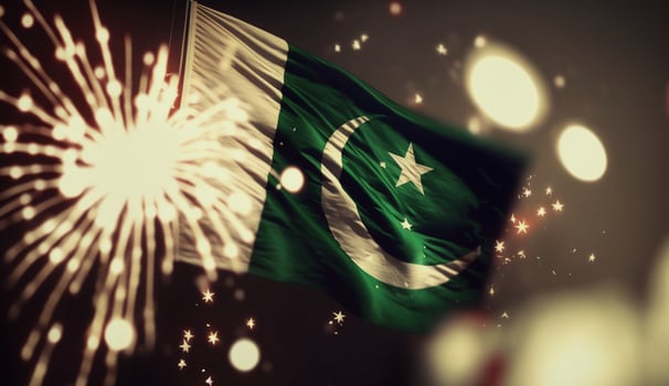 Independence day Pakistan banner with a flag on dark background with fireworks photo