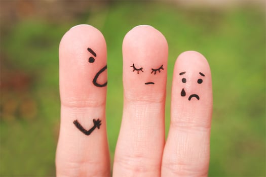 Finger art of a family during an argument. The concept of a man scolds his wife and child, a woman is sad, the baby is crying photo