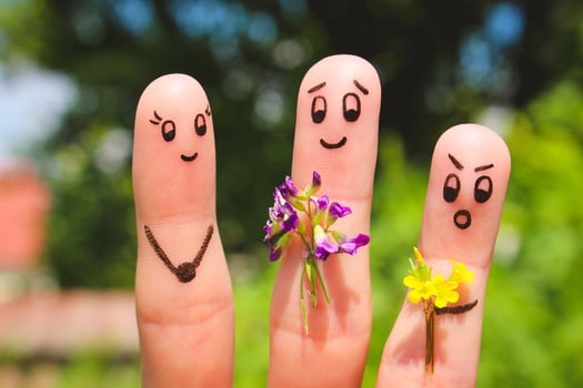 Finger art. Men give flowers flowers to a woman. photo
