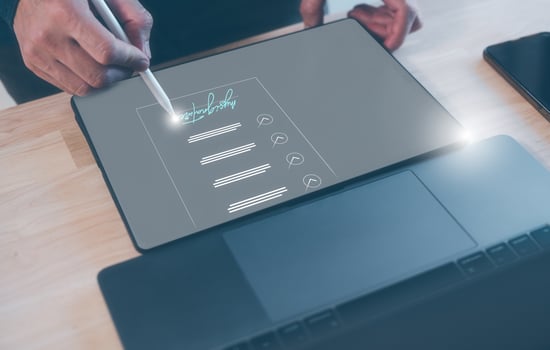 Electronic signature, e-signing, digital document management, paperless office, signing business contract concept. businessman signing on electronic document on tablet photo