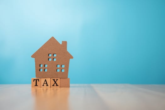 Wooden house on tax. The concept of finance and investment in property residential and tax payment. photo