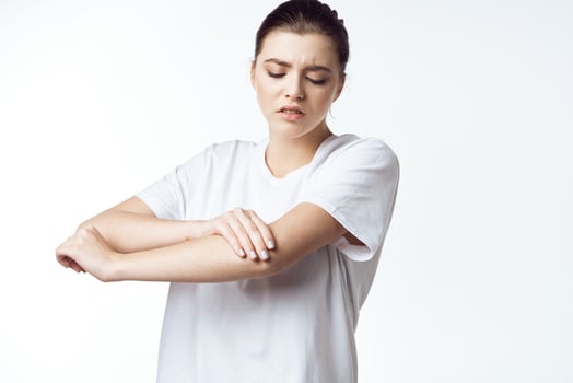 sick woman in white t-shirt pain health problems dissatisfaction photo