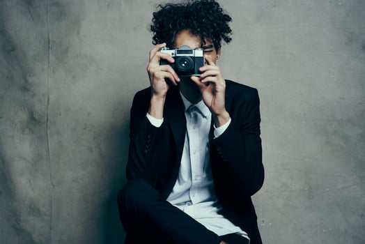 handsome man in studio with camera fabric background classic suit model photo