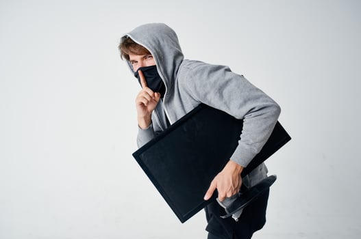 male thief hooded head hacking technology security isolated background photo