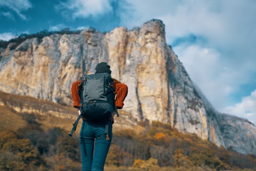 woman hiker mountains rocky stone travel landscape photo