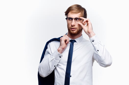business man with a jacket over his shoulders wearing glasses self-confidence official photo