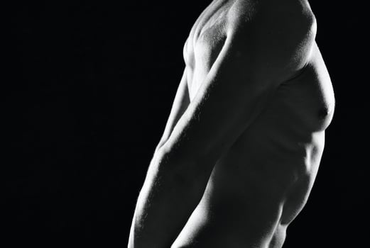 a man in black panties an inflated body black and white photo fitness