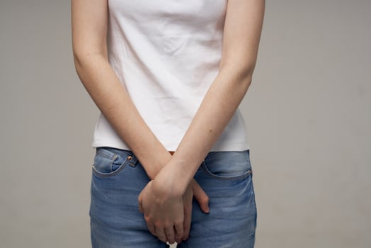 sick woman groin pain intimate illness gynecology light background photo