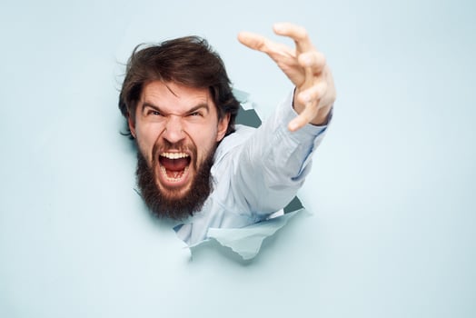 Angry man gestures with his hands dissatisfaction emotions work office photo