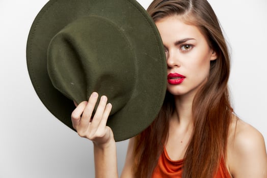 Emotional woman with hat evening makeup photo