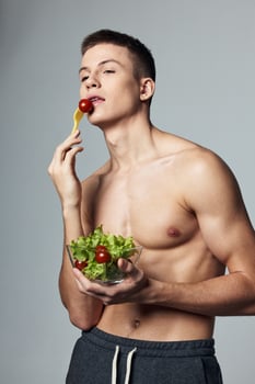 athletic man training healthy food plate with vegetable salad photo