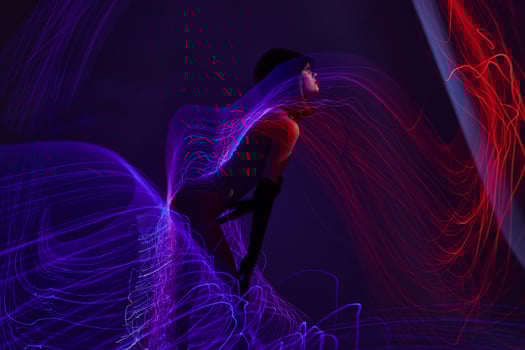 Pretty young female disco neon lines luxury fashion color background unaltered photo